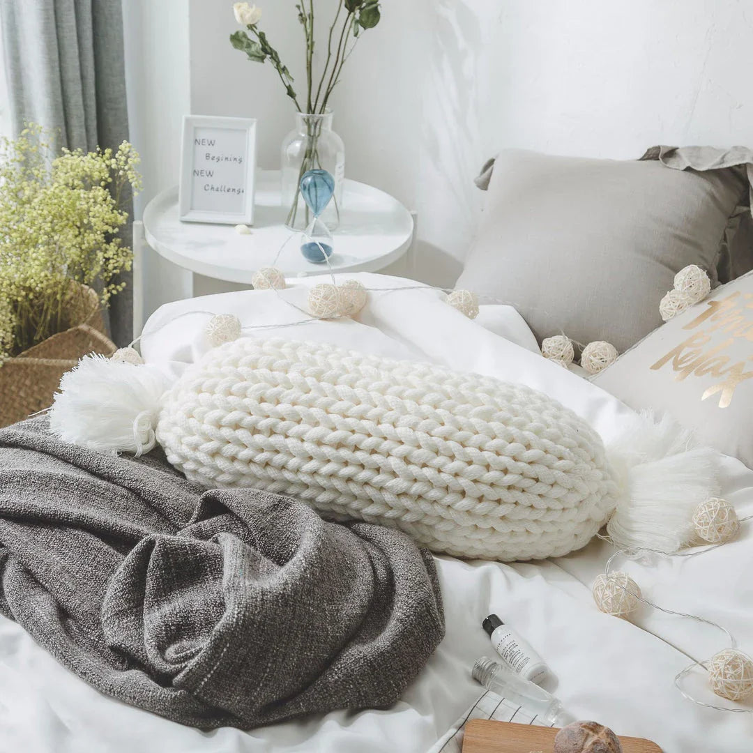 Cosy candy-shaped chunky knit pillow with adorable tassel design, perfect for adding a playful touch to your Kiwi home decor