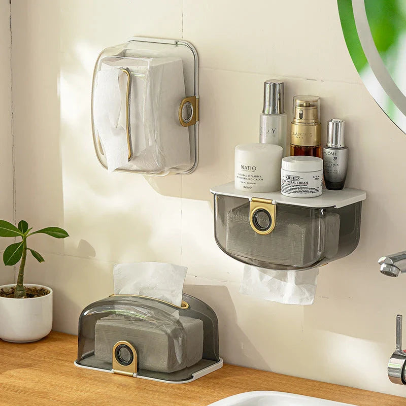 A modern, grey wall-mounted tissue dispenser with a sleek, stylish design to keep tissues and face towels organised in the bathroom or kitchen.