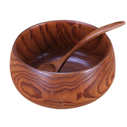 A large, round wooden soup bowl with a warm, natural brown color, perfect for serving hearty meals in Kiwi kitchens.
