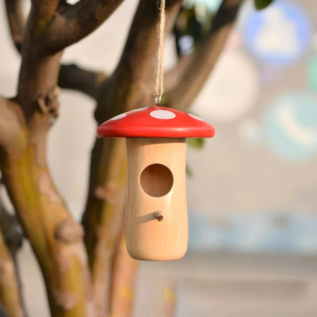 Charming wooden hummingbird nest in a Kiwi garden, designed to attract and shelter local bird species