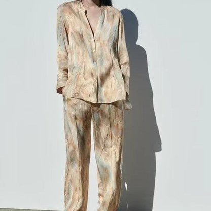 Stylish asymmetric tie-dye shirt and straight-leg trousers set in vibrant colors, perfect for the modern Kiwi wardrobe.