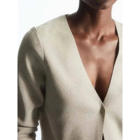 Stylish V-Neck Merino Wool Cardigan in a classic solid color, perfect for layering during the Kiwi winter season.