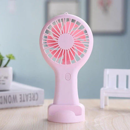 Compact USB-powered mini fan with adjustable speeds and quiet operation, ideal for home, office, and travel use