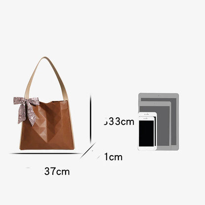 Stylish large-capacity tote bag with a geometric design, made from durable PU leather and featuring a spacious interior and convenient magnetic closure.