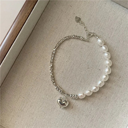 Elegant heart-shaped pearl and sterling silver necklace, a timeless accessory for the modern New Zealand style.