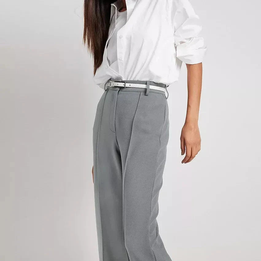 High waist pleated wide-leg trousers in a classic solid color, perfect for the modern Kiwi woman's wardrobe.