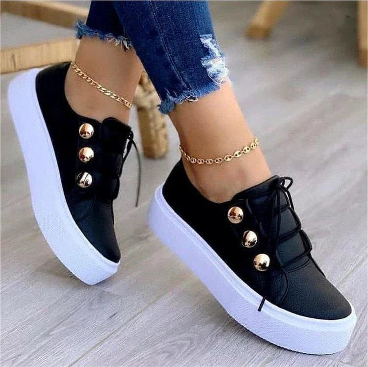 Stylish lace-up flat sneakers for women in a variety of colors, featuring a sleek design and durable construction