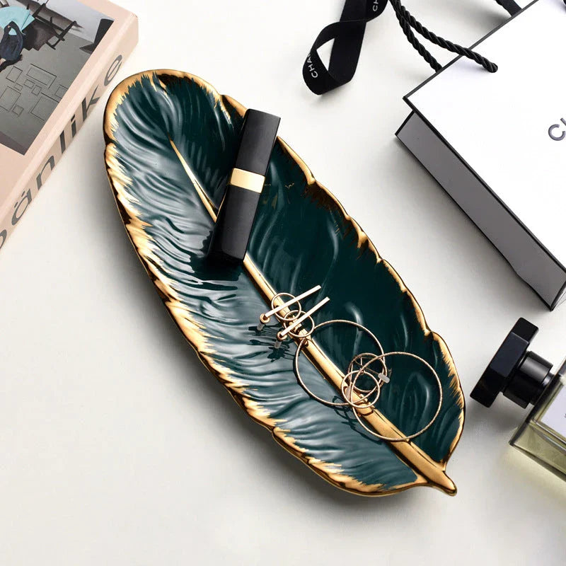 Elegant feather-shaped ceramic storage tray in white with hand-painted designs, perfect for serving, organizing, and decorating your Kiwi home