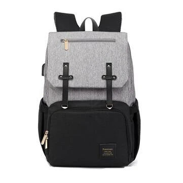 Versatile Mummy Daddy Backpack in Grey, a functional and stylish nappy bag for Kiwi families with a spacious main compartment, insulated pockets, and a USB charging port.