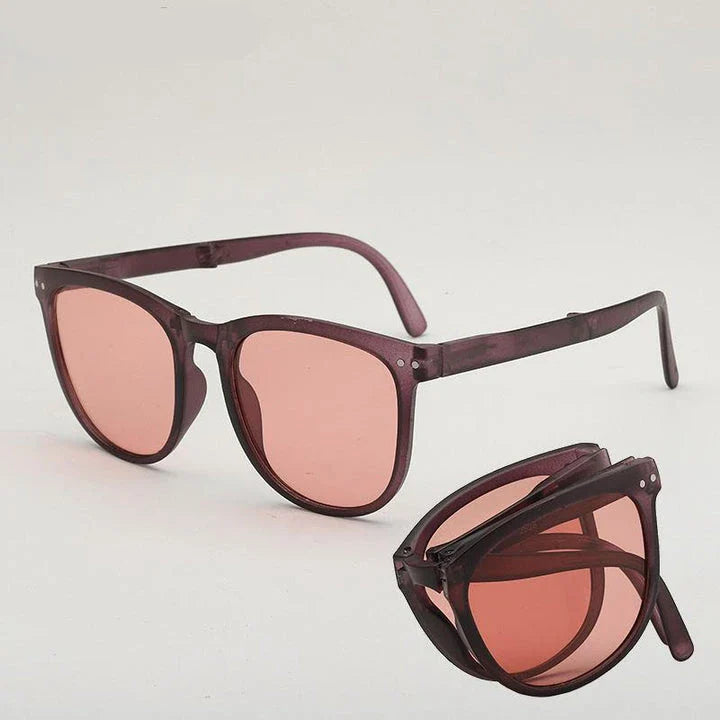 Stylish foldable sunglasses for women with UV400 protection and a rimless oval frame design