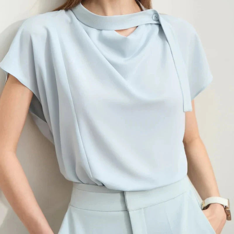 Minimalism Summer Solid Women's Blouse in Blue, featuring a loose swing neck, tie sleeves, and hollow-out decoration for a chic, breathable summer office look.