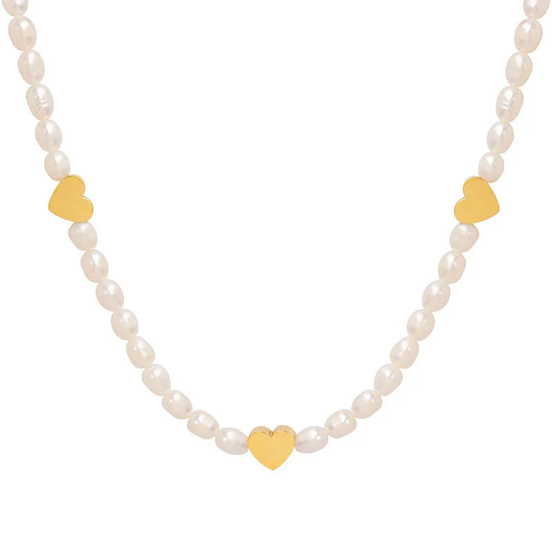 Peach Heart Freshwater Pearl Necklace with a delicate heart design and shimmering pearls, made of durable titanium steel for long-lasting wear