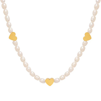 Peach Heart Freshwater Pearl Necklace with a delicate heart design and shimmering pearls, made of durable titanium steel for long-lasting wear
