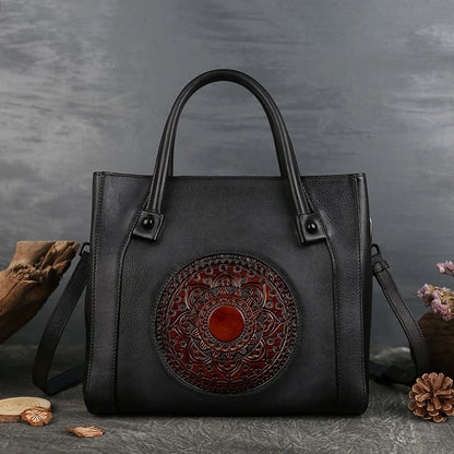 Stylish diagonal leather handbag in red, brown, and gray colours, featuring a roomy interior, multiple pockets, and a comfortable hard handle