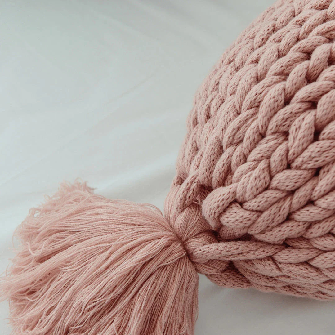 Cosy candy-shaped chunky knit pillow with adorable tassel design, perfect for adding a playful touch to your Kiwi home decor