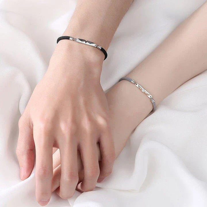 Sterling silver couple's bracelet with elegant angel wing design, adjustable size for both men and women