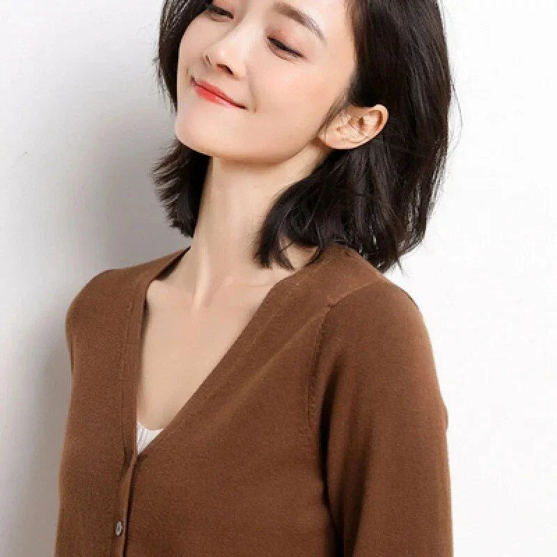 Stylish v-neck cardigan in various colors, featuring a flattering design and luxurious cashmere-rich composition for the modern Kiwi woman