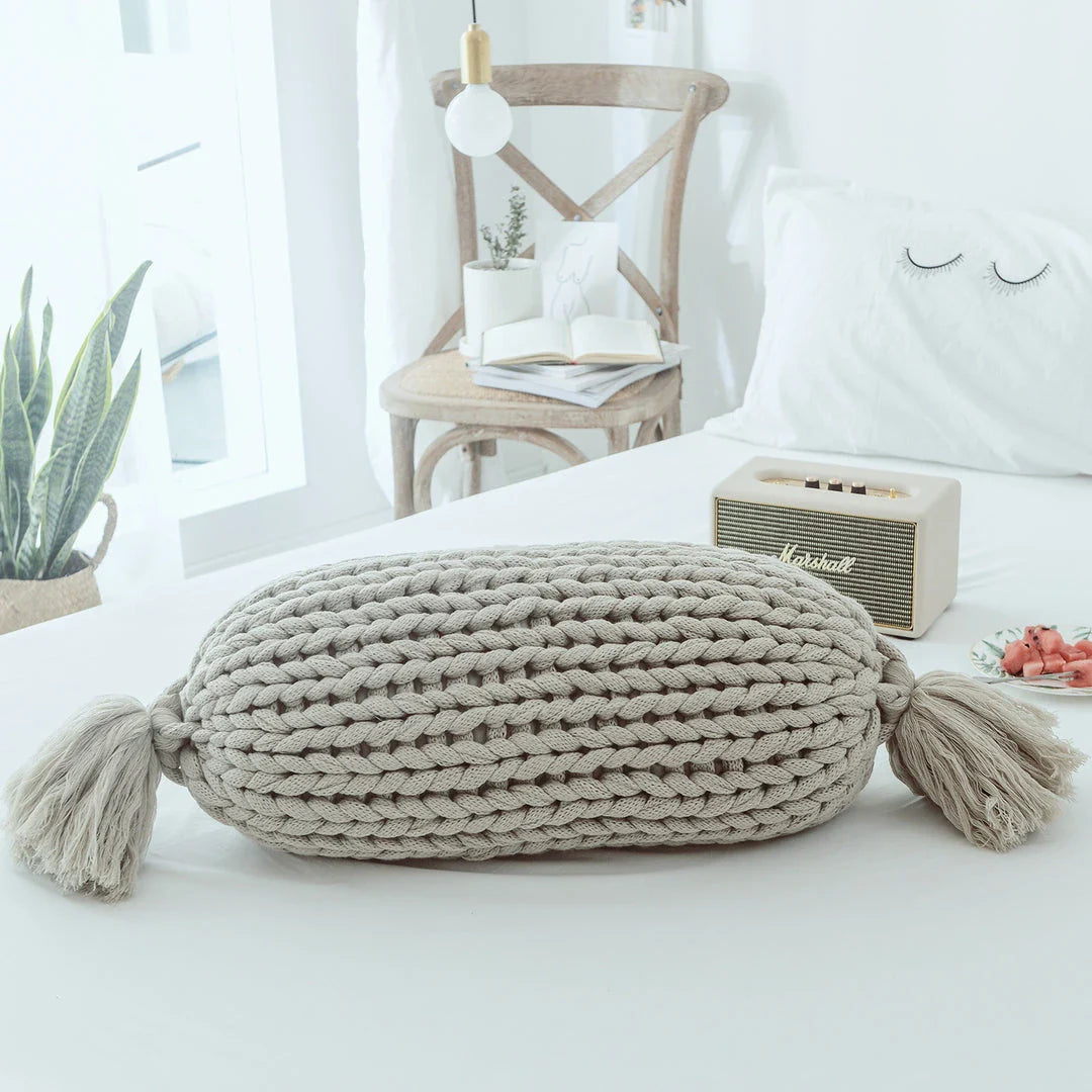 Cosy candy-shaped chunky knit pillow with adorable tassel design, perfect for adding a playful touch to your Kiwi home decor