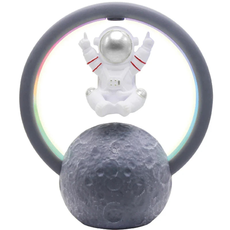 Stylish levitating astronaut Bluetooth speaker with suspended gold or silver finish, delivering powerful sound and a mesmerizing display for Kiwi tech enthusiasts.