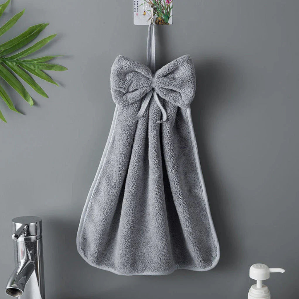 Soft, absorbent coral velvet hand towels with a unique bow design, perfect for Kiwi homes