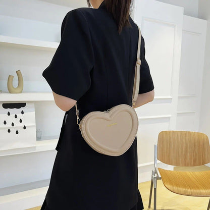 Stylish heart-shaped crossbody bag made from premium PU leather, available in multiple colours for the modern Kiwi woman
