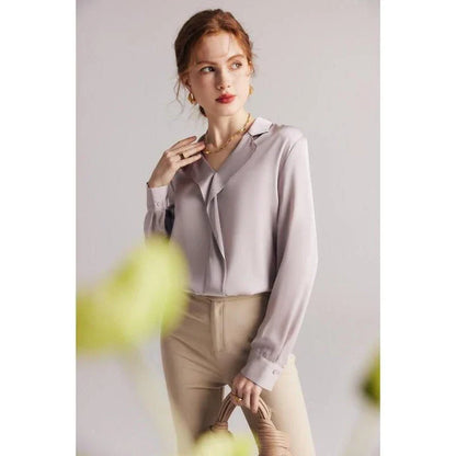 Elegant ruffled silk blouse in champagne color with V-neck design, suitable for professional or casual wear