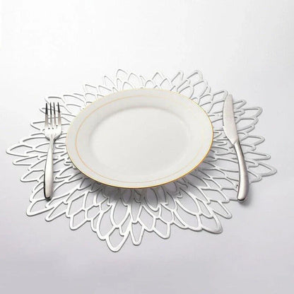 Flower-shaped PVC placemat in gold color, adding natural beauty and elegance to a dining table setting.