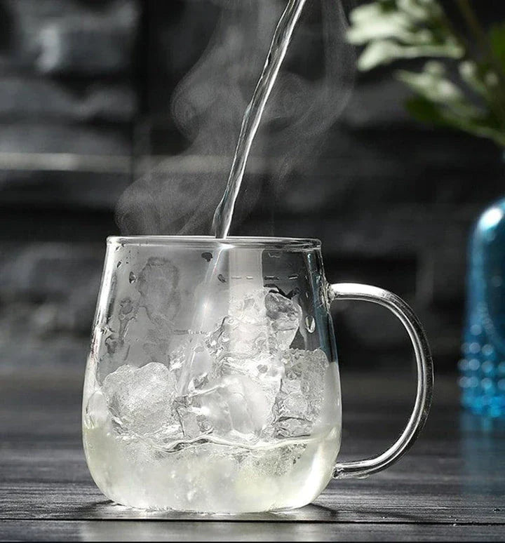 A sleek, minimalist glass tea mug with a touch of Chinese-inspired elegance, perfect for enjoying hot or cold beverages.