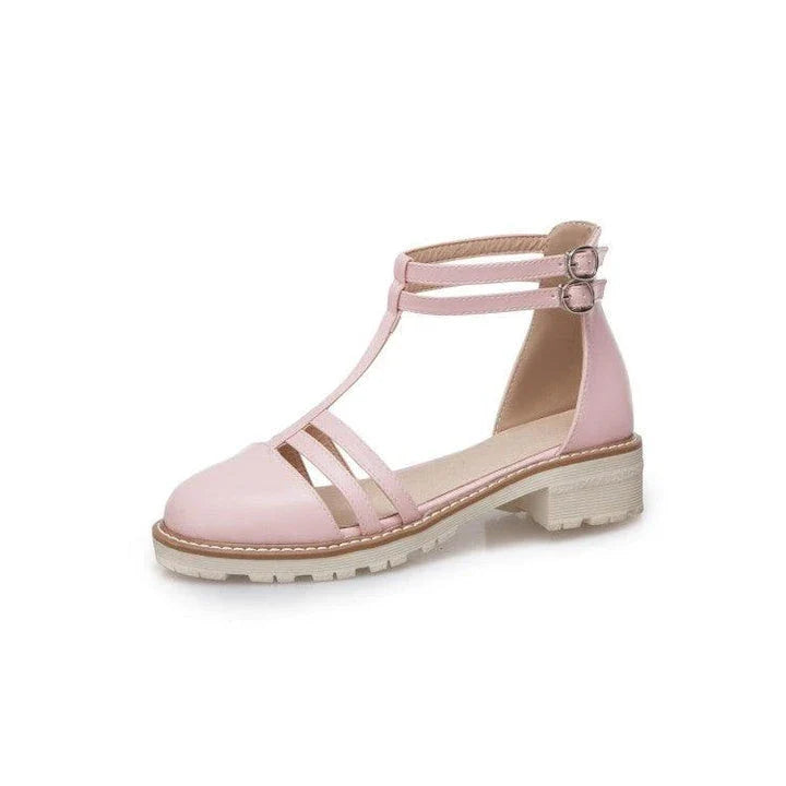 Stylish flat-bottomed buckle sandals in pink, suitable for warm-weather wear in New Zealand