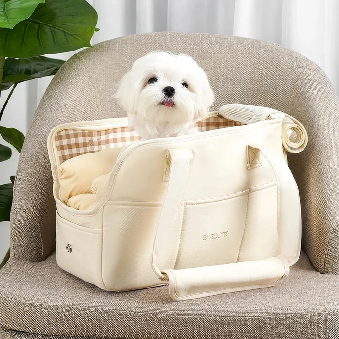 A stylish and practical cotton shoulder bag carrier for small dogs, with a hard board base and cozy interior for comfort and security during adventures.