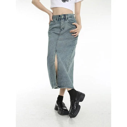 A stylish vintage-inspired denim midi skirt with a front slit, perfect for casual and special occasions.