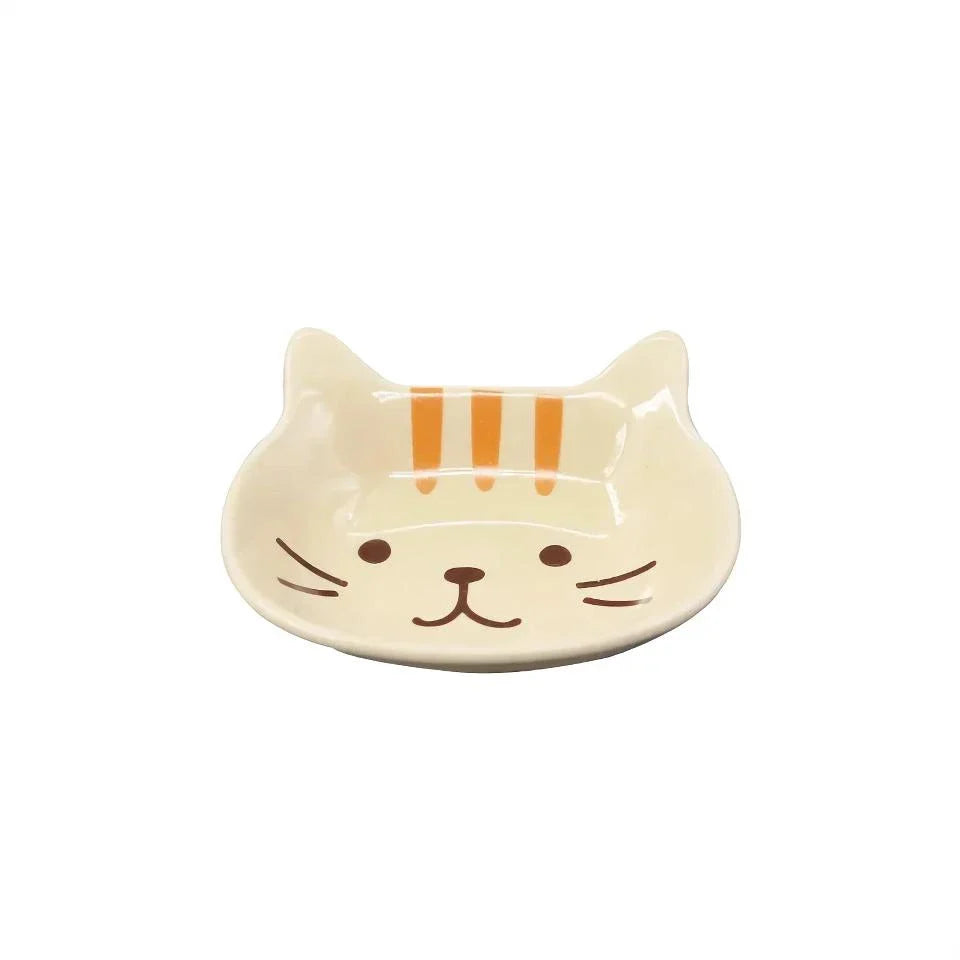 Charming Japanese-style ceramic condiment dish with a playful cat design, perfect for serving sauces, dips, and small snacks.