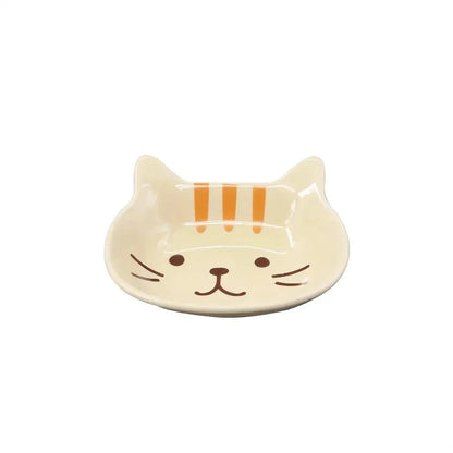 Charming Japanese-style ceramic condiment dish with a playful cat design, perfect for serving sauces, dips, and small snacks.