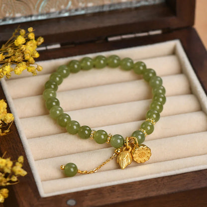 Handcrafted Hotian jade bracelet with a vintage-inspired floral design, a timeless Kiwi treasure