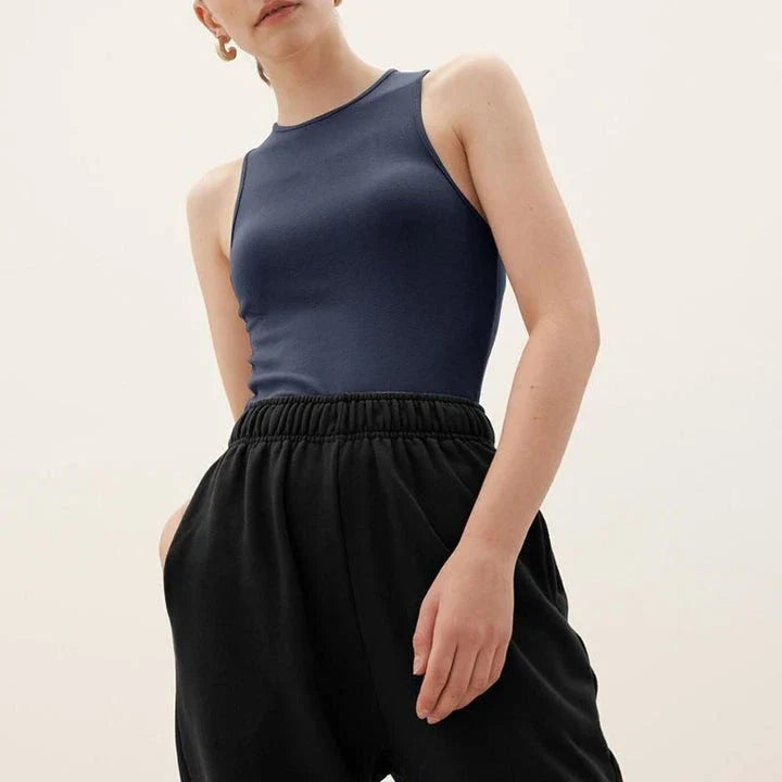 Stylish summer bodycon tank top for Kiwi women, featuring a comfortable and flattering design in a classic beige color.