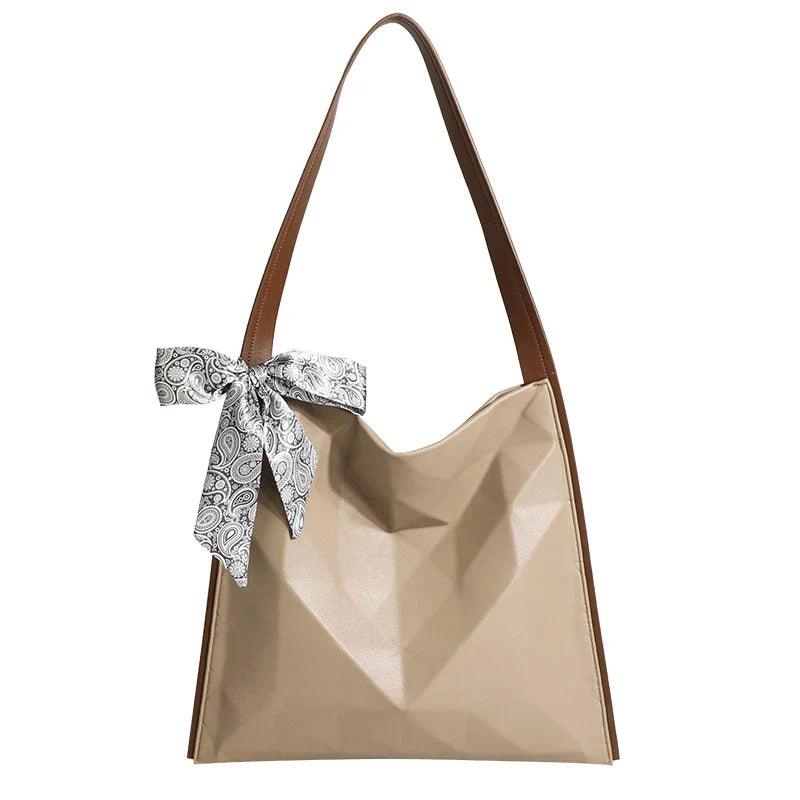 Stylish large-capacity tote bag with a geometric design, made from durable PU leather and featuring a spacious interior and convenient magnetic closure.