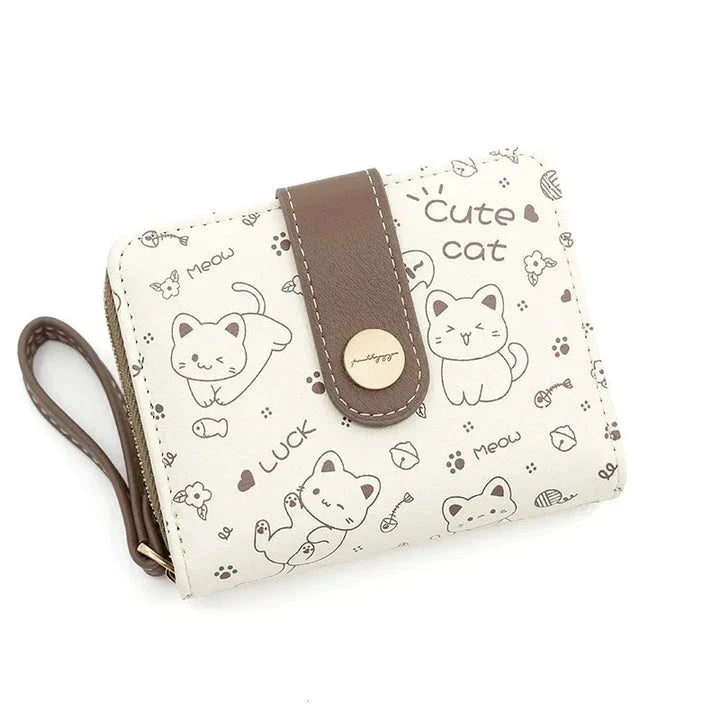 A stylish compact wallet featuring a playful cat-themed design with a tilted head motif, available in a range of candy-inspired colours.