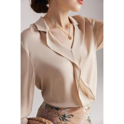 Elegant ruffled silk blouse in champagne color with V-neck design, suitable for professional or casual wear