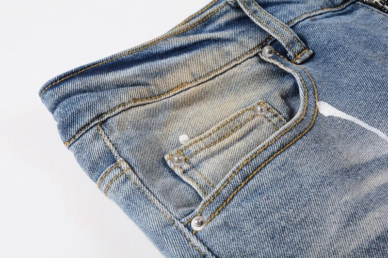 Vintage-inspired jeans with rhinestone and ink splash detailing, perfect for the modern Kiwi lifestyle
