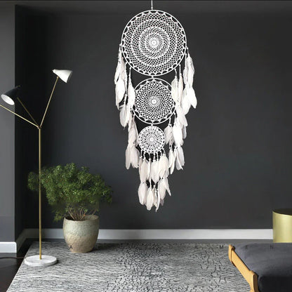 Vibrant, handcrafted dreamcatcher wall hanging with feathers, wood, and beads, adding a touch of Kiwi-inspired charm to any home.