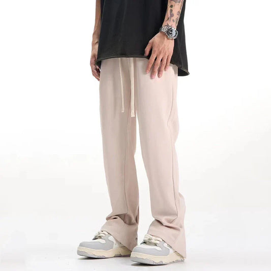 Retro-inspired casual suit pants in black and apricot colors, featuring a mid-waist design and straight leg silhouette for a comfortable, versatile Kiwi look.