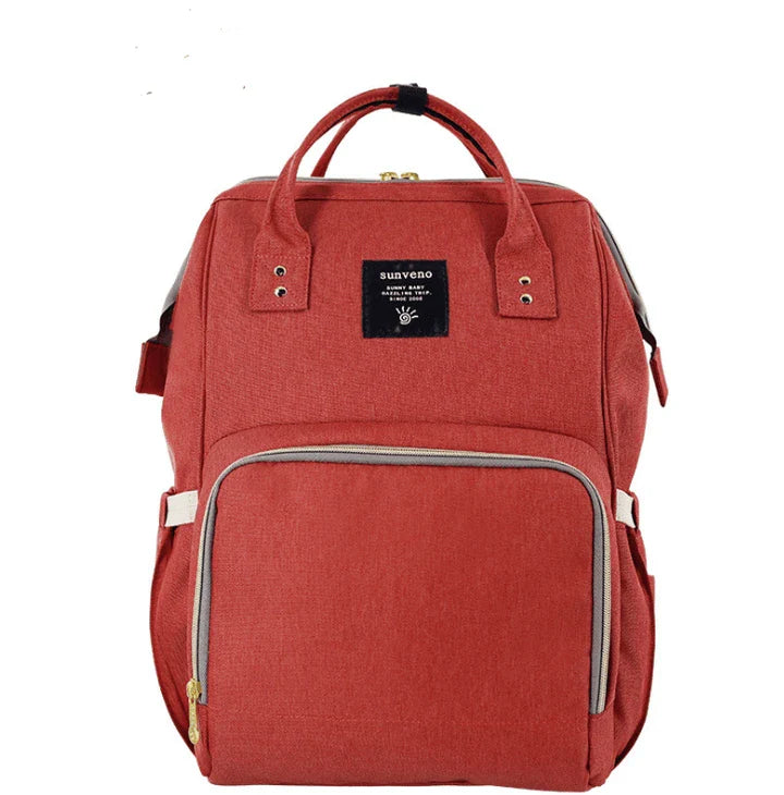 Stylish and practical mummy bag with reinforced handles, durable buckles, and separate bottling area for Kiwi mums