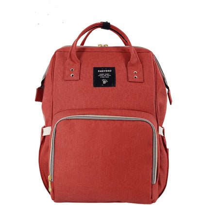 Stylish and practical mummy bag with reinforced handles, durable buckles, and separate bottling area for Kiwi mums