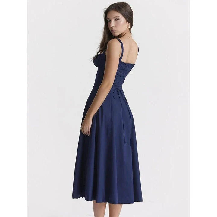 Elegant backless midi sundress in blue, featuring a high split and A-line silhouette for a flattering fit