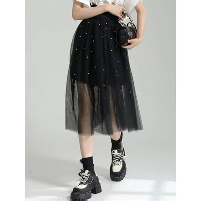 Stylish Dot Mesh Midi Skirt in black, featuring an asymmetrical silhouette and delicate dot mesh overlay