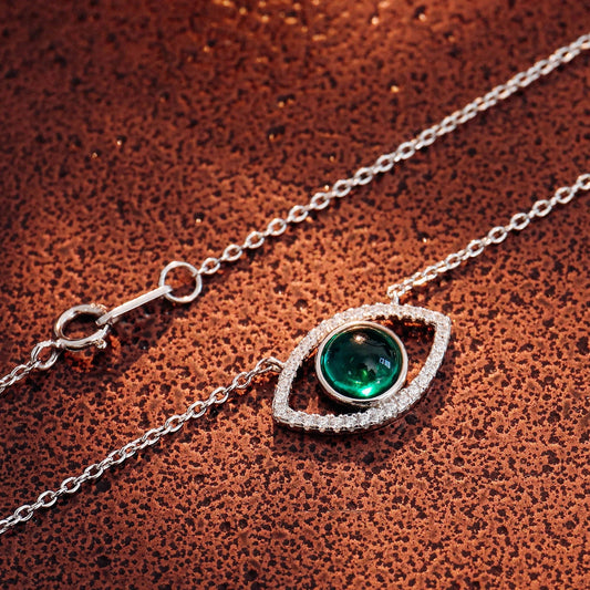 Elegant silver necklace with a captivating cultivated emerald stone, the perfect accessory for Kiwis to elevate their style.