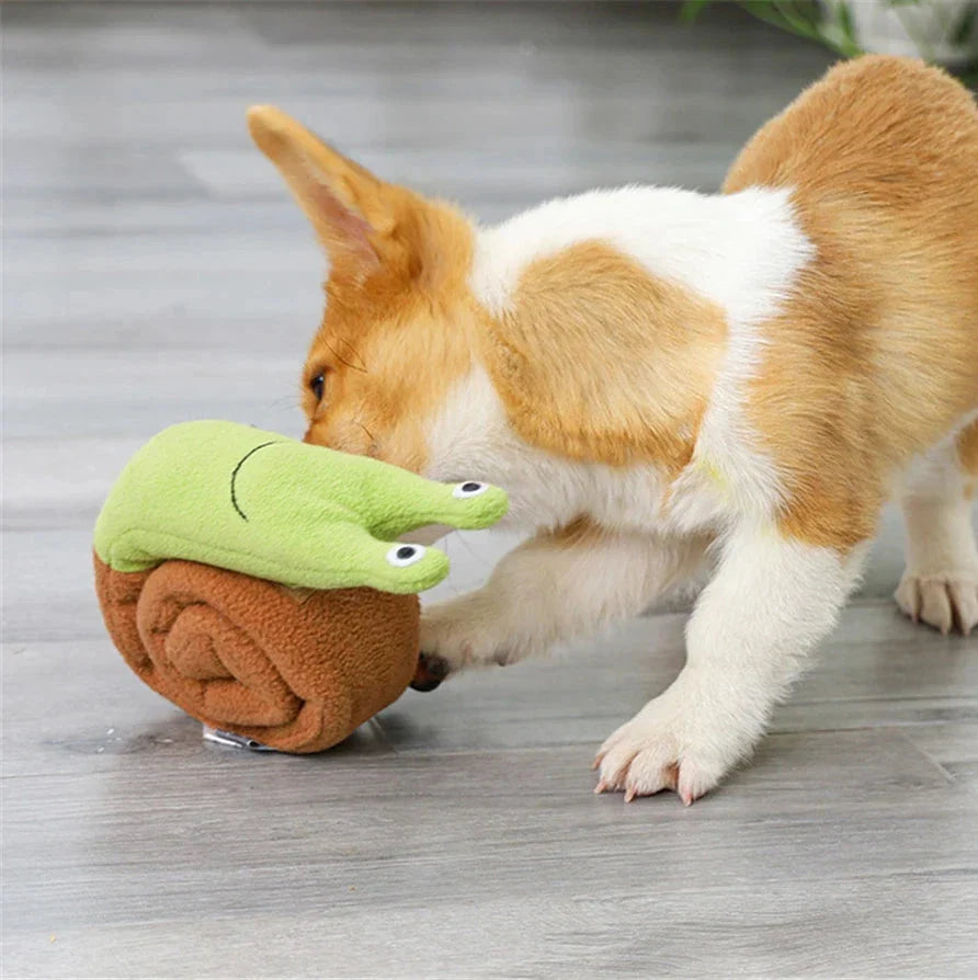 Soft, plush snail-shaped snuffle mat toy for dogs, with multiple treat-hiding pockets and a built-in sound generator for added engagement and mental stimulation.