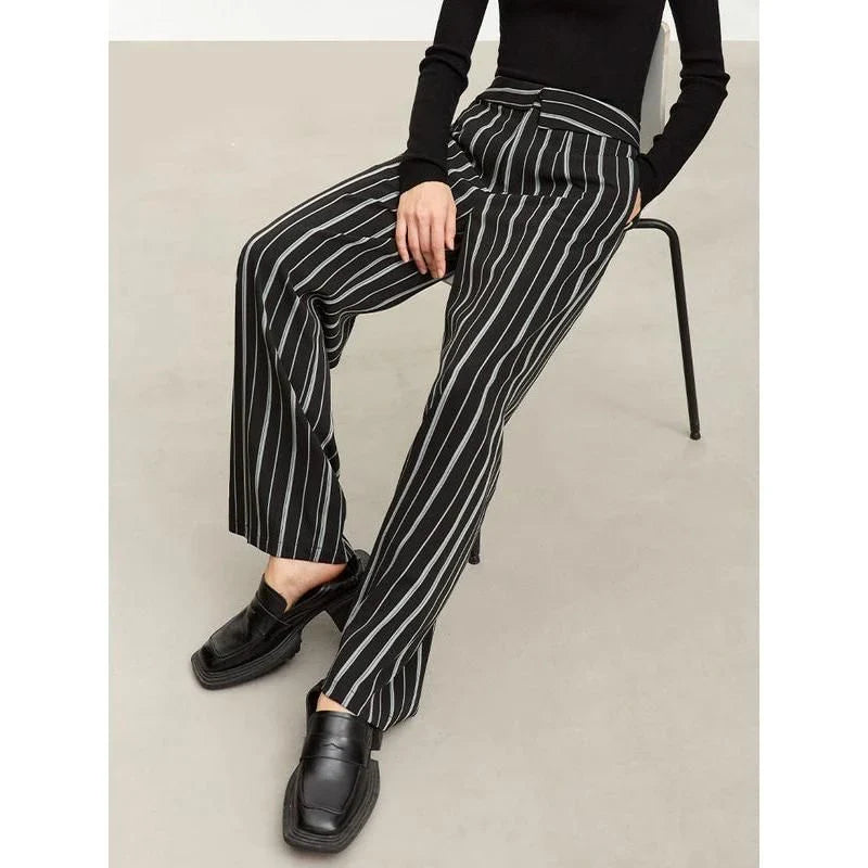 Elegant autumn wide-leg striped trousers for women in a classic black and white pattern