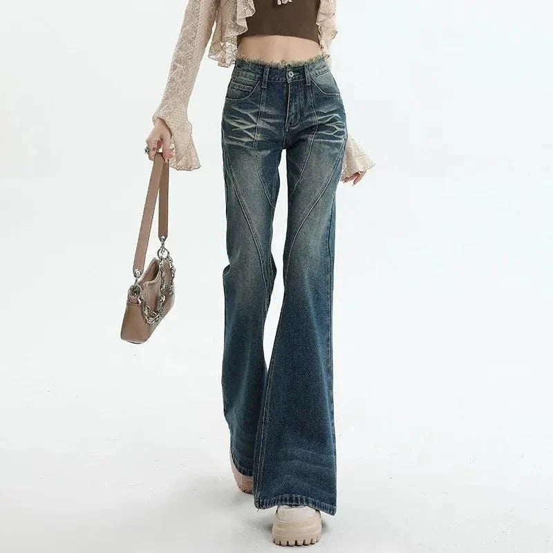 Pair of high-waisted flare jeans in a vintage wash, featuring functional details like tassels and buttons for a stylish, Kiwi-inspired look.