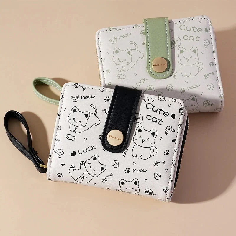 A stylish compact wallet featuring a playful cat-themed design with a tilted head motif, available in a range of candy-inspired colours.